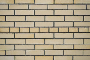 wall of beige brick - background. Horizontal texture