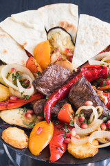 Set of grilled lamp, vegetables, and bread. Traditional Azerbaijani meal Sadg