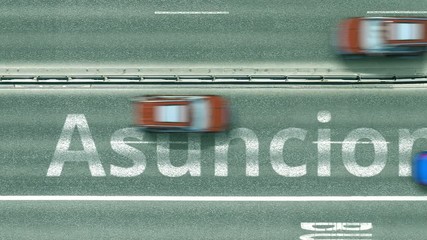 Overhead view of the busy car road with Asuncion text. Travel to Paraguay intro clip