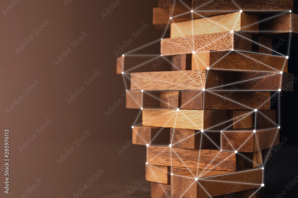 Wall mural business organize management strategy ideas concept wood stack block tower arranging with dark backg