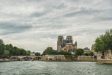 Fototapeta na wymiar The View of Notre Dame Cathedral from the River Seine in Paris