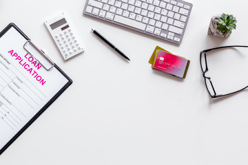 loan application with bank cards and keyboard on white background top view copyspace