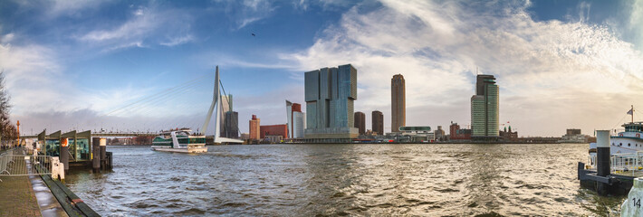 Naklejka premium Cityscape, panorama, banner - view of the city embankment and the Erasmus Bridge, as well district Feijenoord city of Rotterdam, The Netherlands