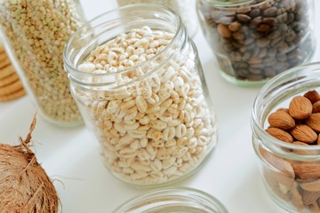Various cereals, coffee, nuts, bran in glass jars. Zero waste concept, free plastic.