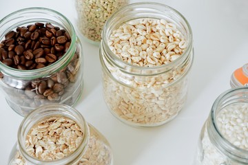 Various cereals, coffee, nuts, bran in glass jars. Zero waste concept, free plastic.