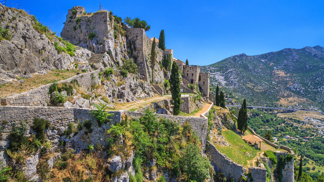 Summer mediterranean landscape - view of the Klis Fortress, which is located near Split on the Adriatic coast of Croatia