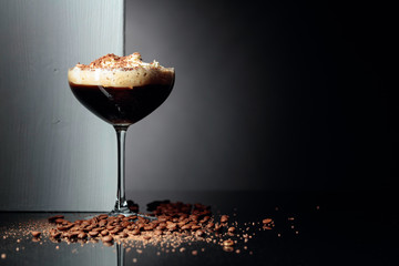 Coffee cocktail with whipped cream sprinkled with chocolate chips.