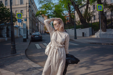 Beautiful woman walks through the streets of Moscow