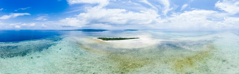 Obraz premium Aerial view tropical beach island reef caribbean sea. Indonesia Wakatobi archipelago, Tomia Island, marine national park. Top travel tourist destination, best diving snorkeling.