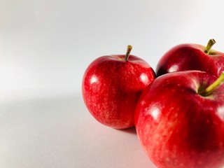 red ripe apples on white background
