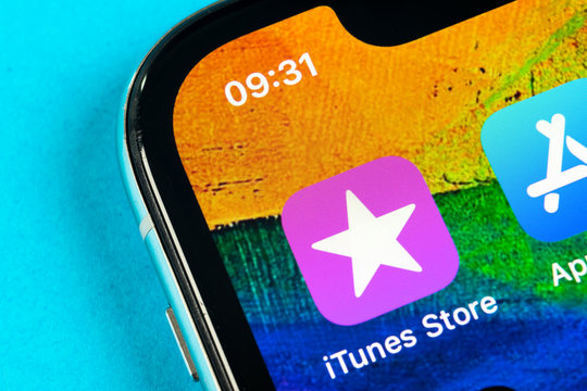 Helsinki, Finland, May 4, 2019: Apple iTunes store application icon on Apple iPhone X smartphone screen close-up. Mobile application icon of itunes store. Social network. AppStore. itunes store