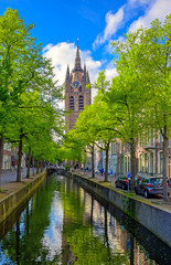 Naklejka premium The canals and waterways in the city of Delft in The Netherlands on a sunny day.