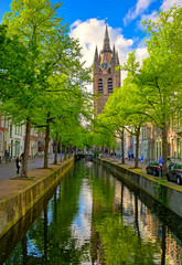The canals and waterways in the city of Delft in The Netherlands on a sunny day.