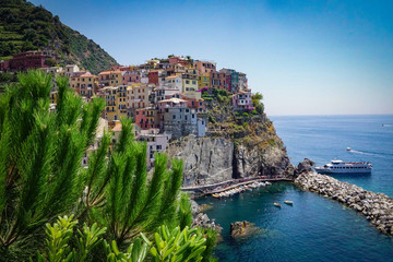 MANAROLA, ITALY - JULY 4, 2019: Beautiful fishing village in Cinque Terre with colorful facades and sea view 