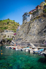 MANAROLA, ITALY - JULY 4, 2019: Beautiful fishing village in Cinque Terre with colorful facades and sea view 