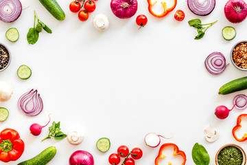 Sliced, cut, chopped vegetables frame on white background top view copyspace