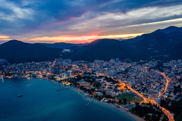 Aerial view of Budva, Montenegro on Adriatic coast after sunset.