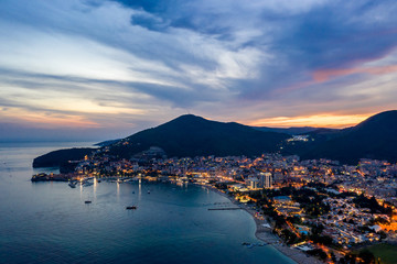 Aerial view of Budva, Montenegro on Adriatic coast after sunset.