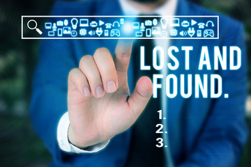 Word writing text Lost And Found. Business photo showcasing a place where lost items are stored until they reclaimed Male human wear formal work suit presenting presentation using smart device