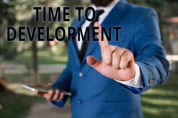 Word writing text Time To Development. Business photo showcasing a length of time during which a company grows or develop Businessman with pointing finger in front of him