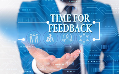 Fototapeta na wymiar Writing note showing Time For Feedback. Business concept for information about reactions to a product or services Male wear formal work suit presenting presentation smart device