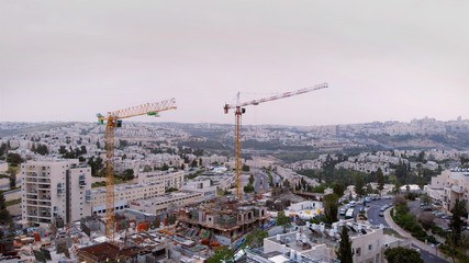 Jerusalem construction site and crane Aerial view Flying over Cranes and construction site in Jerusalem 