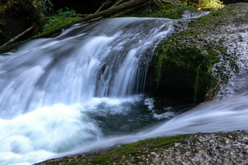 Fototapeta na wymiar Flowing cascades in the scenic eistobel Canyon in the bavarian Allgau, Germany, Europe