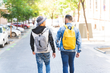 Two Latin American Friends Walking Together to University .