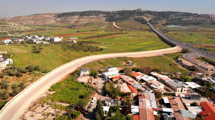 Israel Security wall aerial View Aerial footage of the Israeli Palestine wall close to Givon  and...