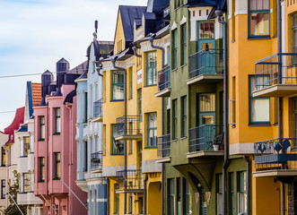 Helsinki, Finland, August 10, 2019: Colorful houses along the most beautiful street Huvilakatu in...