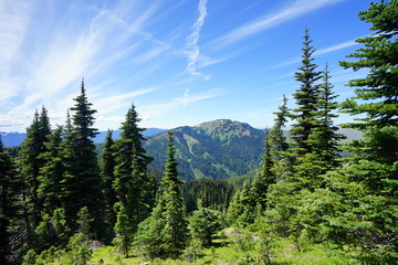 Beautiful cloud over snow capped mountains in Olympic National Park in summer in Washington, near Seattle