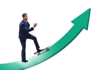 Obraz premium Businessman riding skateboard on financial graph