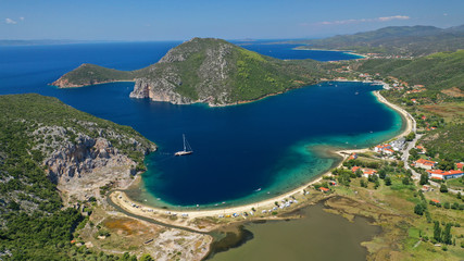 Naklejka premium Aerial drone photo of iconic paradise bay and sandy beach of Porto Koufo with turquoise calm sea protected by winds, South Sithonia Peninsula, North Greece