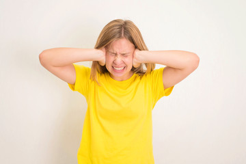 Teenager girl closed her ears not to listen. Portrait of teenager holds her hands over her ears not to hear. want to listen to you or loud noise, is