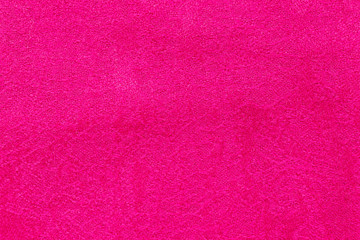 Background in the form of a red wool product with a textured pattern over the entire area, top view