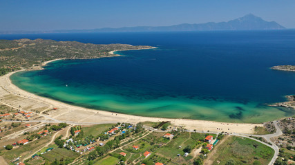 Obraz premium Aerial drone top down photo of secluded turquoise sandy beach of Sykia in South Sithonia peninsula, Halkidiki, North Greece