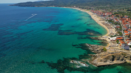 Aerial drone photo of famous village and long sandy beach of Sarti in South Sithonia, Halkidiki, Greece