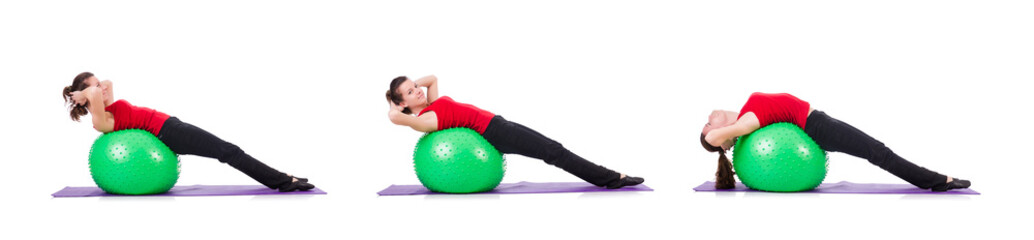 Young woman exercising with swiss ball