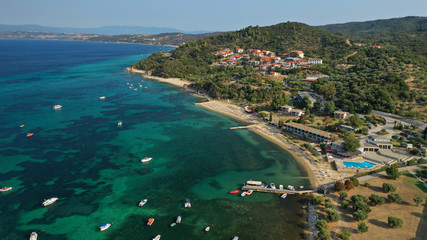 Fototapeta premium Aerial drone view of iconic medieval seaside town of Ouranoupolis featuring famous tower, Halkidiki, North Greece