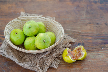 Ripe fig fruits on the wooden table.