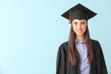 Female graduate on color background