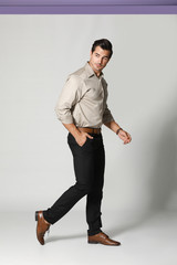 Fashionable man on light background