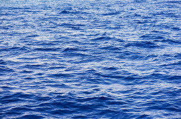  Sea surface. Blue water background. (selective focus)
