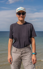 Langrune-Sur-Mer, France - 08 10 2019:  Portrait of a Girl walking on the beach