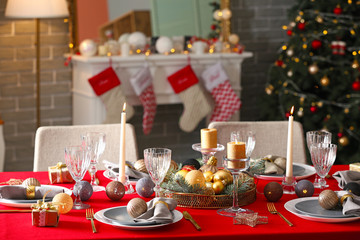 Festive table setting for Christmas dinner at home