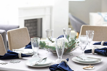 Festive table setting for Christmas dinner at home