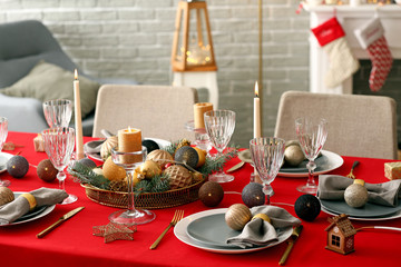 Festive table setting for Christmas dinner at home