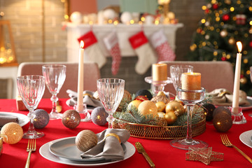 Festive table setting for Christmas dinner at home