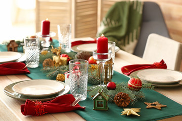 Festive table setting for Christmas dinner at home