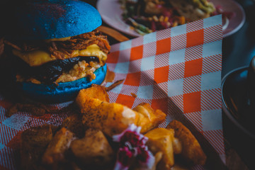 Veggie Burger  with chips on the wooden dish